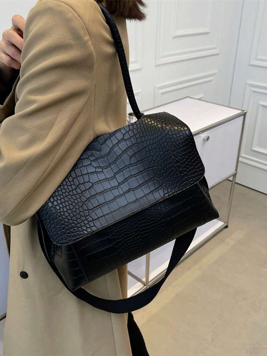 Varelle Croc-Embossed Satchel in black, worn on the shoulder