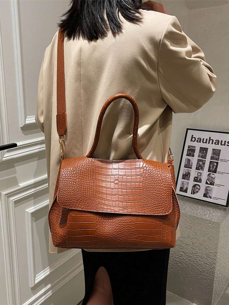 Varelle Croc-Embossed Satchel in brown, carried on the back