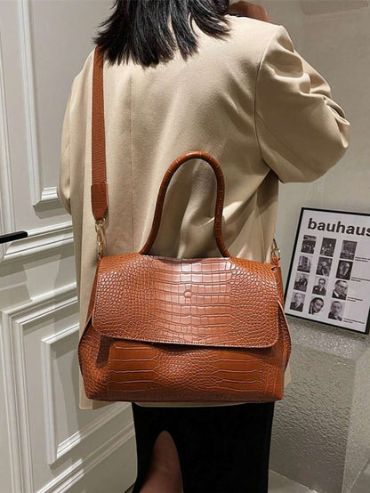 Varelle Croc-Embossed Satchel in brown, carried on the back