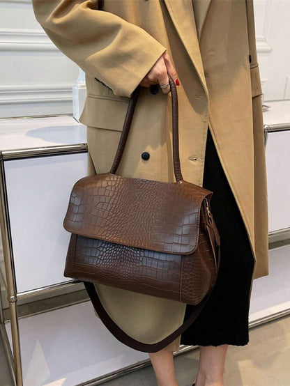 Varelle Croc-Embossed Satchel in coffee brown, carried by hand