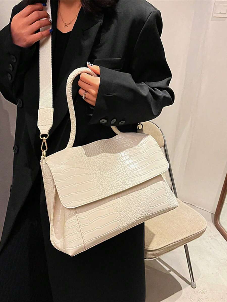 Varelle Croc-Embossed Satchel in beige, carried by hand