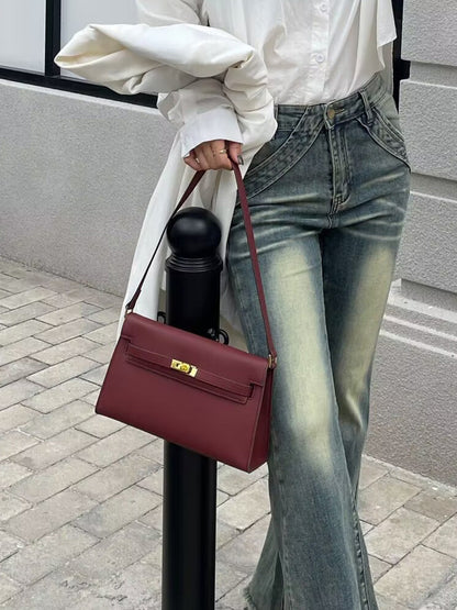 Élise Envelope Shoulder Bag in Bordeaux red, worn on the shoulder