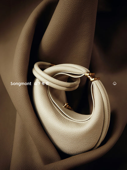 Aria Leather Crescent Bag in cream, close-up
