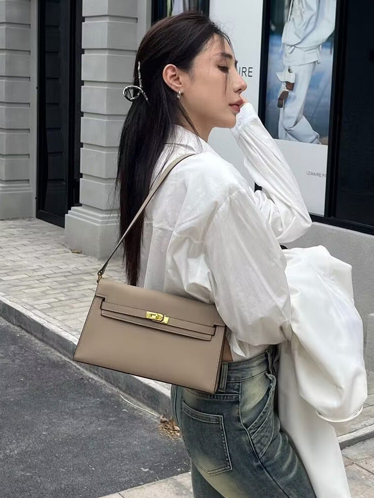 Élise Envelope Shoulder Bag in khaki, worn on the shoulder