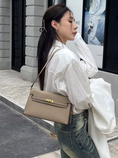 Élise Envelope Shoulder Bag in khaki, worn on the shoulder