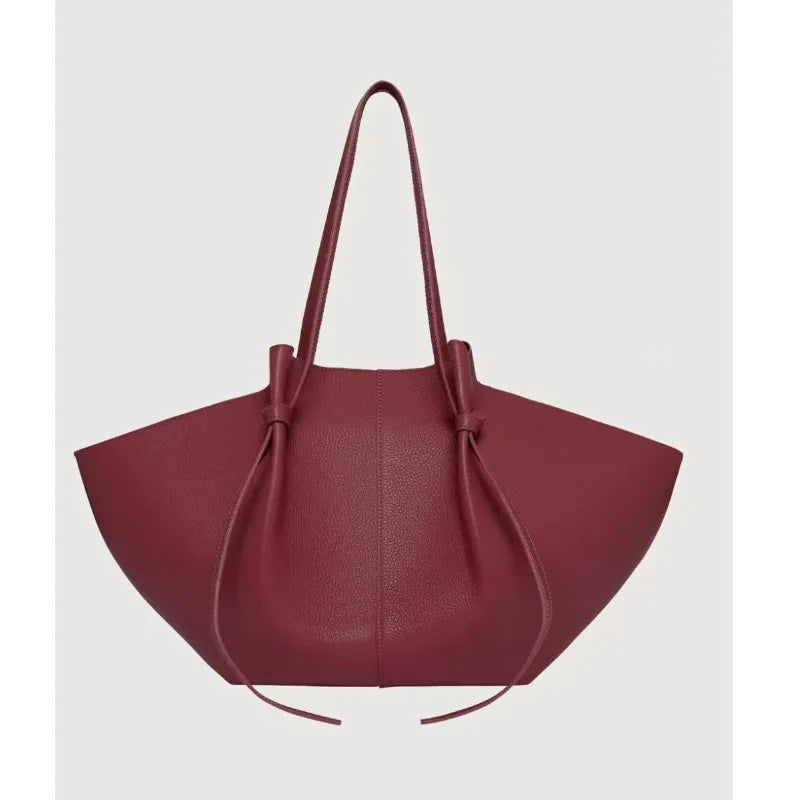 Aurore Winged Tote in cognac red, front view